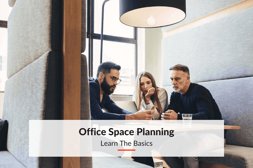 colleagues in a hybrid workplace planning the office space